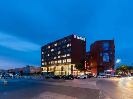 Echarm Hotel (Nanjing Olympic Sports Center Hongyang Home Expo Center Subway Station) Отели рядом с достопримечательностью «Nanjing Qing'ao Center»