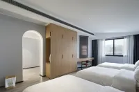 Muqi Jiushe Design B&B (Longyan Railway Station Minxi Trading City)