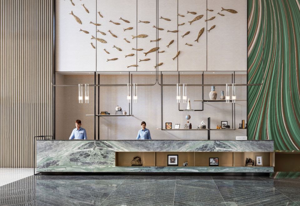 The hotel features a lobby and reception area with large windows on both sides, creating an artistic atmosphere at Four Points by Sheraton Hong Kong Tung Chung