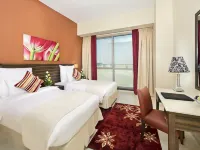 Abidos Hotel Apartment Dubai Land Hoteles cerca de Universidad Zayed