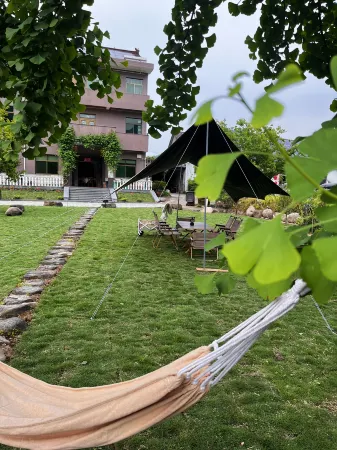 Longyinju Hostel Отели в г. Тунлу