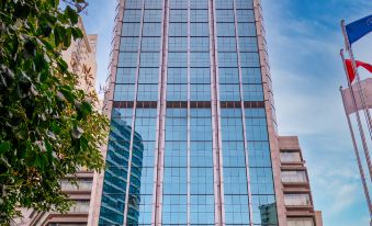 "There is a large building with an exterior view that has the word ""hotel"" displayed on the front" at Metropark Jichen Hotel Shanghai