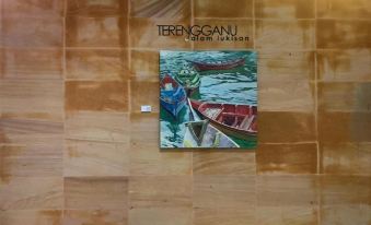 a wooden wall with a painting of a boat and two people on the other side at Duyong Marina & Resort