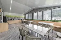 Muqi Jiushe Design B&B (Longyan Railway Station Minxi Trading City)