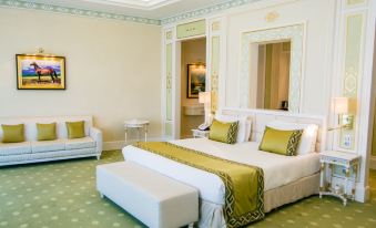 In the middle room, there is a large bed with two lamps and a table on each side that match at Yyldyz