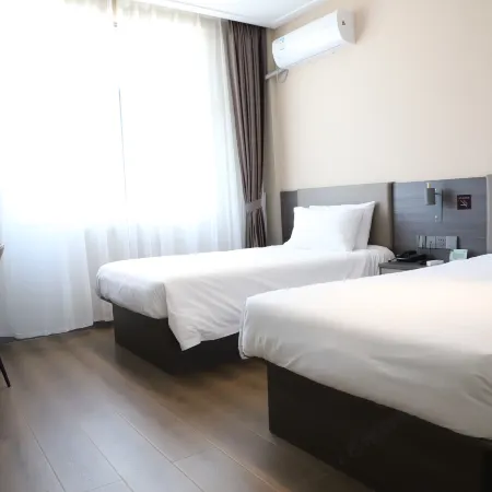 Huianda Traveler-Inn Hotel (Yichun Zhangshu East Station)