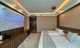 a hotel room with two beds , a television , and a projector mounted on the wall at Gushi Oriental Earl Hotel (Yucheng Avenue Genqin Culture Park)