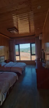 Hongtu Qicai Renjia Hostel Отели рядом с достопримечательностью «Dongchuan Red Land»