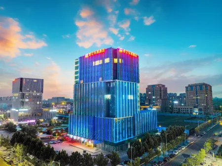 Kunlun Leju Hotel (Xinzheng Xuanyuan Lake) Отели рядом с достопримечательностью «Huang Di's Hometown»