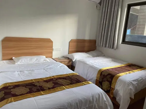 Xiongqi Hotel - Inns