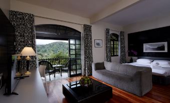 a cozy living room with a couch , coffee table , and sliding glass door leading to an outdoor patio at Strawberry Park Resort