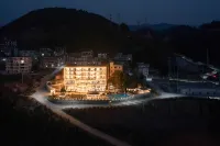 Enshi Qilihuajian Homestay Hôtels à : Enshi