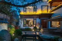 Shiting Huayi Holiday Homestay Отели в г. 