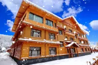 雪鄉與你·初見酒店（雪韻大街店） Отели в г. Хайлин