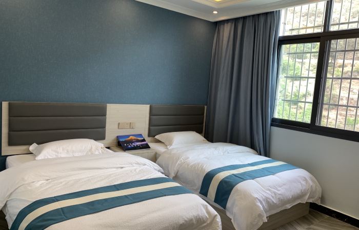Muli Xinsheng Business Hotel