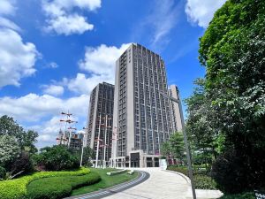 Woqu Service Apartment (Xintang Wanda Plaza Branch)