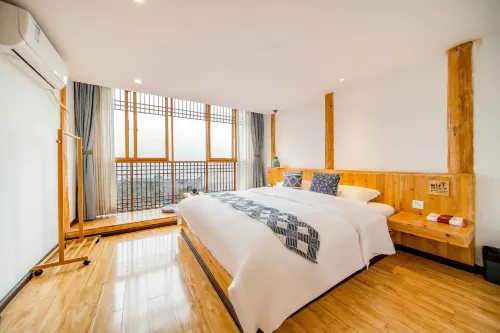 Jiuqi Xijiang Qijian Hostel - Yolcu Alma/Bırakma Hizmetleri