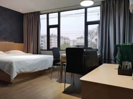 Fenyi Weixi Yipin Hotel Отели в г. Фэньи