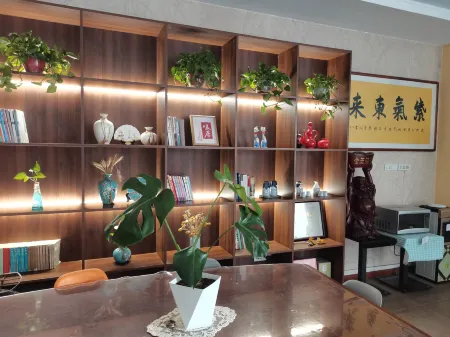 Xingping Aishang Qingshe Hotel Отели в г. Синпин