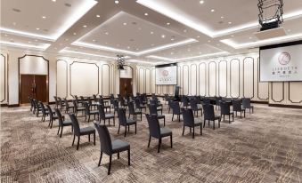 A spacious conference room with rows of chairs in the center for events or conferences at Lisboeta Macau