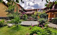 Puzhehei Riverside Inn - Parkplatz