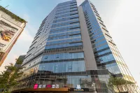 Echarm Plus Hotel (Guangzhou Junming Huanle World) Hotel dekat Guangdong Polytechnic College of Agriculture， Industry and Commerce (East to Qiaojian Lvye Mountain Villa)