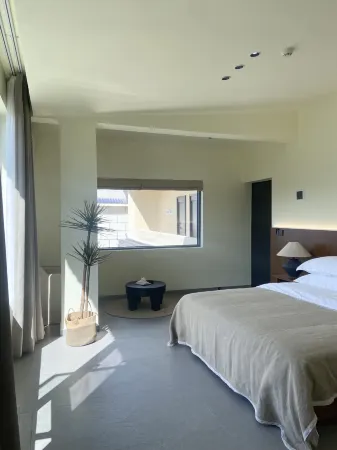 Xinping Lvli Piaoxiang Accommodation Отели рядом с достопримечательностью «Nan'en Waterfall»