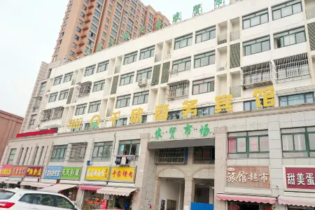 Guannan Qianxin Business Hotel Отели рядом с достопримечательностью «Er'langshen Culture Relics Park»