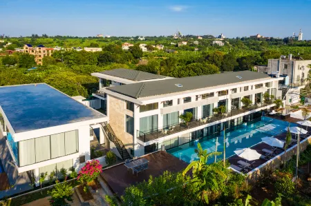 Xidu Hotel Отели рядом с достопримечательностью «Wucai Beach»