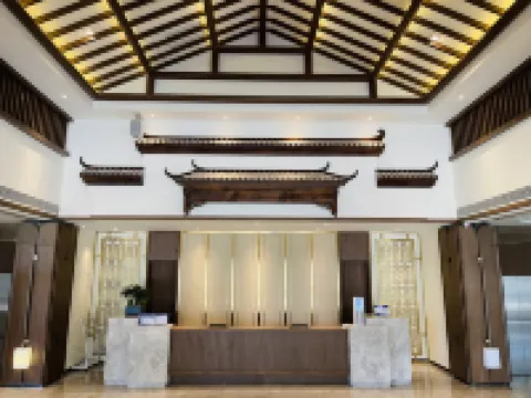 Jinghong Tianqing Hotel (Yijin Holo City Government Shop)