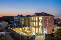 Qingxin Yashe Homestay Отели в г. Наньхуэй и Шанхайский парк диких зверей