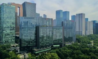 The city features tall buildings and skyscrapers, reaching impressive heights on the upper floors at Hangzhou Marriott Hotel Qianjiang