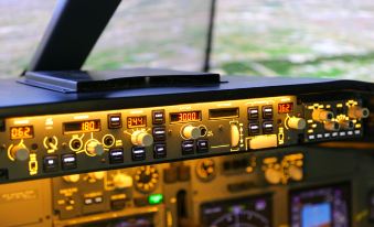The cockpit is equipped with a variety of different types of controls on each side to provide an additional set at Ramada Plaza by Wyndham Shanghai Pudong Airport