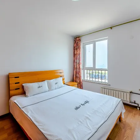Qingdao Jinshatan Xinxin Scenic Apartment Отели рядом с достопримечательностью «Пляж Голден-Бич»