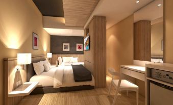 a modern bedroom with a wooden floor , white bed , and two nightstands , one on each side of the bed at Hallmark Regency Hotel - Johor Bahru