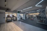 Guoshi Hotel (Dalian Donggang Business District Harbour Plaza Subway Station) - gimnasio
