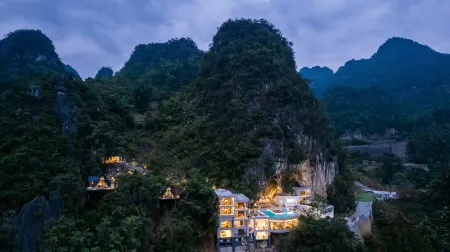 Fengxi Cave Homestay Отели в г. Синъи