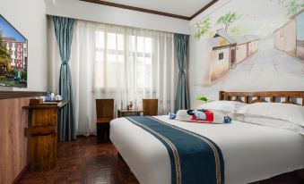 This spacious motel offers a bedroom with a double bed and a large window that overlooks the pool area at Nostalgia Hotel (Beijing Lama Temple, Nanluogu Lane,)