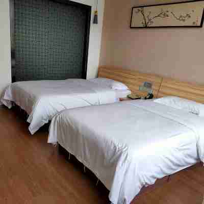 Jin Ningmeng Holiday Hotel Rooms