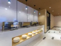 Magnolia Hotel (Jining Jinxiang Garlic Shopping Plaza Kuixing Road Branch) - فطور