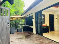Xishuangbanna Chaohuaxi Xiyulin Villa - maisons de vacances