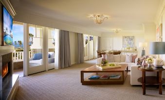 a large , well - lit living room with multiple couches and chairs arranged around a coffee table at Montage Laguna Beach