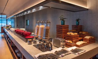 There is a kitchen counter with various types and sizes of items, including an assortment at Grade Hotel Shenzhen sea world