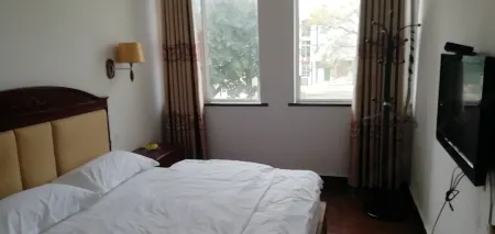 Longxin Business Hotel (Ningming Railway Station) Отели в г. Нинмин