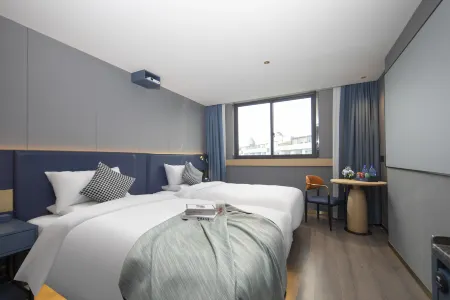 Orange Flower Cinema Hotel（Yiwu International Trade City） Отели рядом с достопримечательностью «Xiaozici Park»