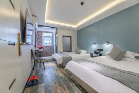 Pebble Motel (Shanghai Pediatric Hospital Lianhua Road Subway Station Branch) Отели рядом с достопримечательностью «Nanfang Xiuxian Guangchang Taiwan Fengqing Street»