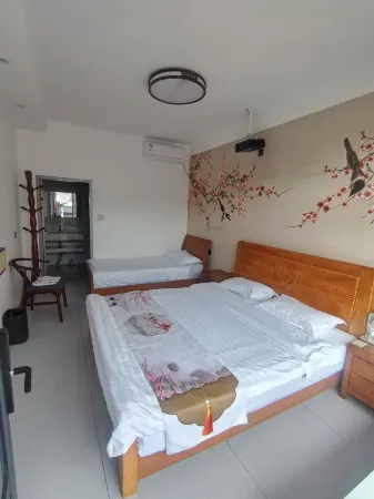 Flower Inn Sevens Mansion Отели рядом с достопримечательностью «Xinzhou Ancient City - South Gate Tower»