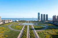 Dalian Xinghai Square Qingchen Floating Light Luxury Hotel Apartment - con vista montagne