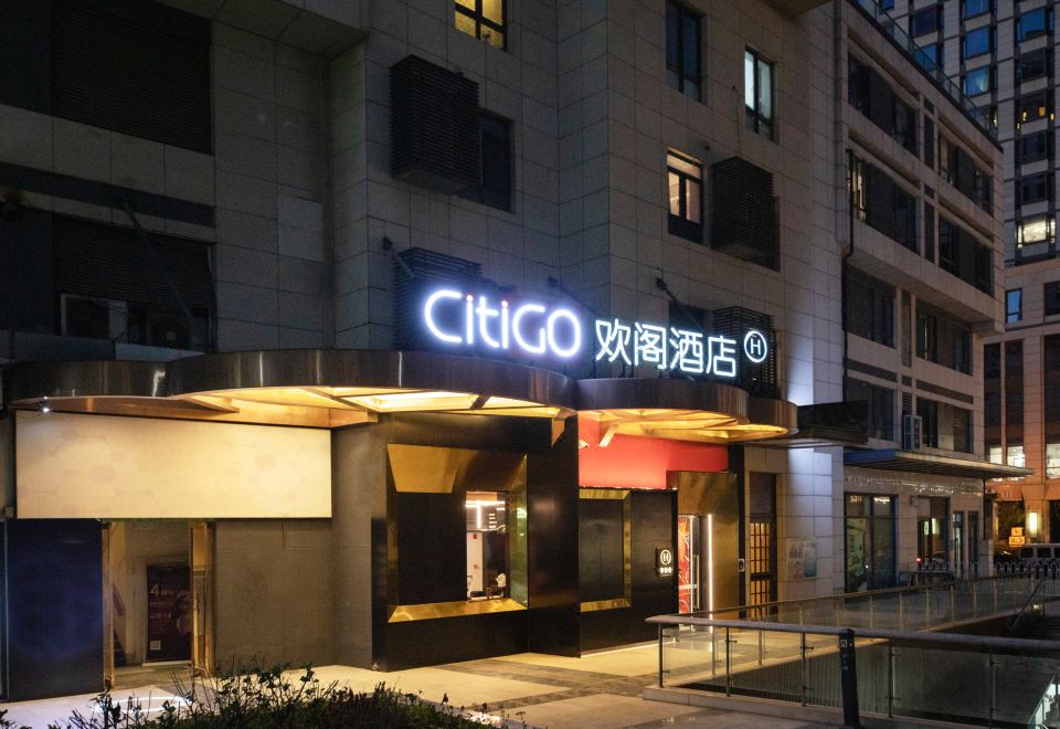 "At night, there is a restaurant entrance with a sign that says ""hotel"" above it" at CITIGO hotel, Sanlitun, Beijing