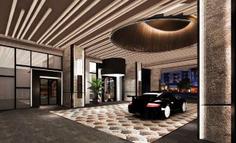 A rendering depicts the entrance to an underground car garage, featuring a prominent piece in the front at Sleeping Lion Suites